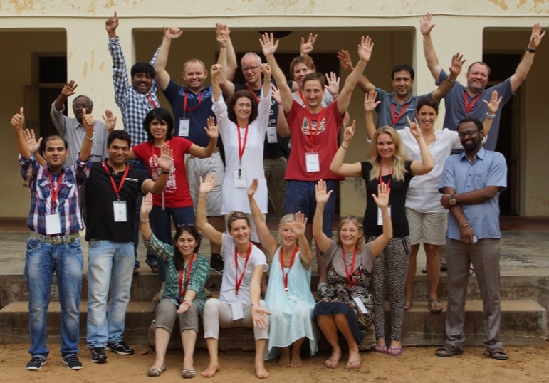 Microsoft leadership team celebrating successful tech hub project in emerging markets