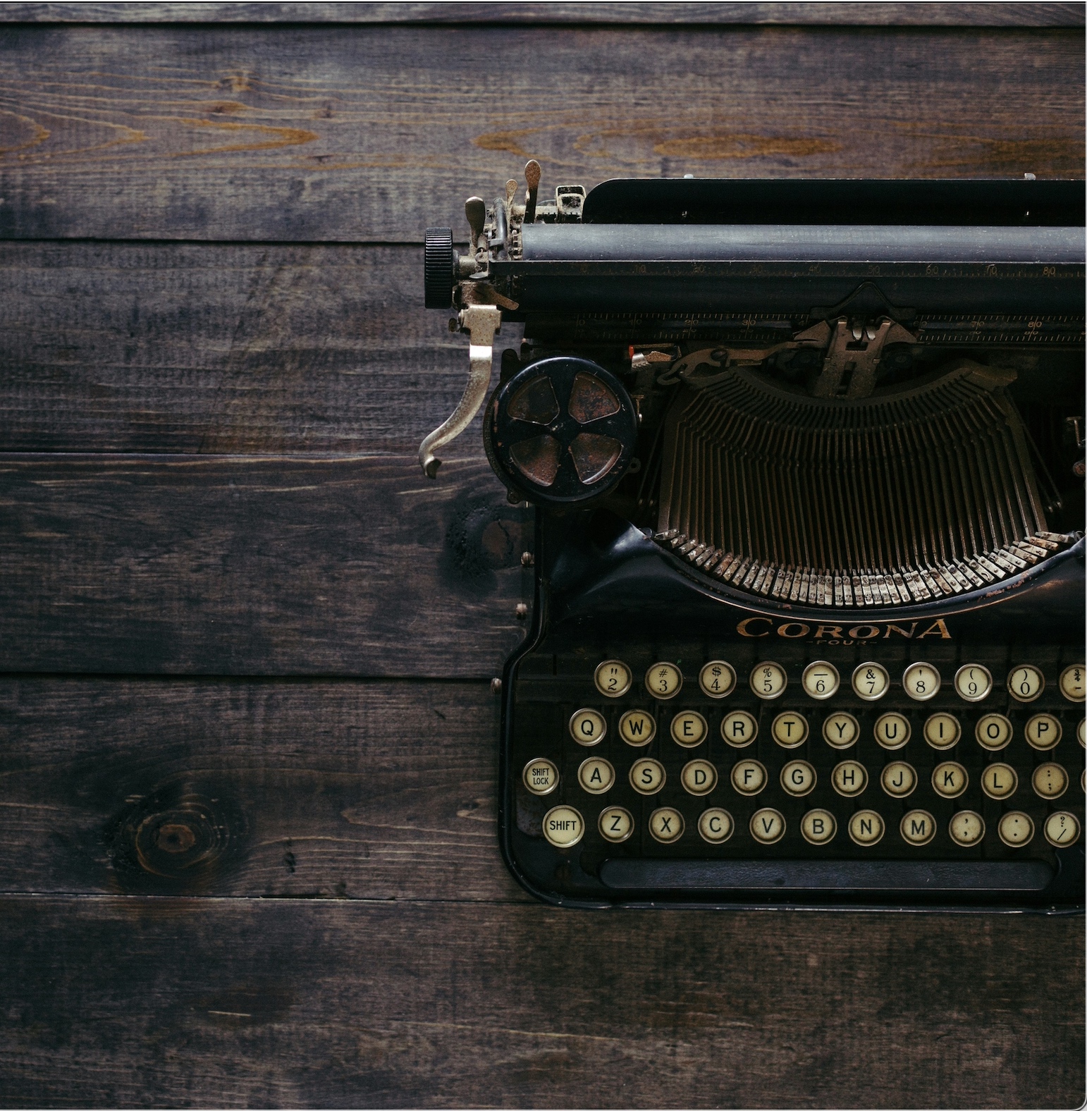 Vintage Corona typewriter on wooden surface